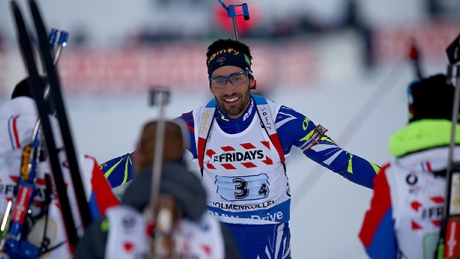 Fourcade, France win biathlon mixed relay world title