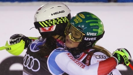 Switzerland beats rival Austria for gold in alpine team event